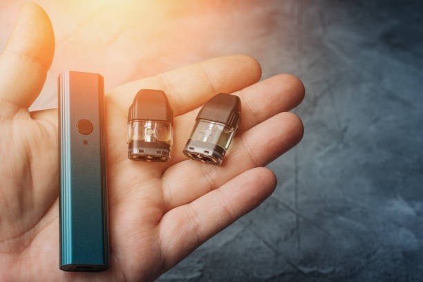 Vape kits, e-liquids, and accessories from Super Vape Store displayed on a table
