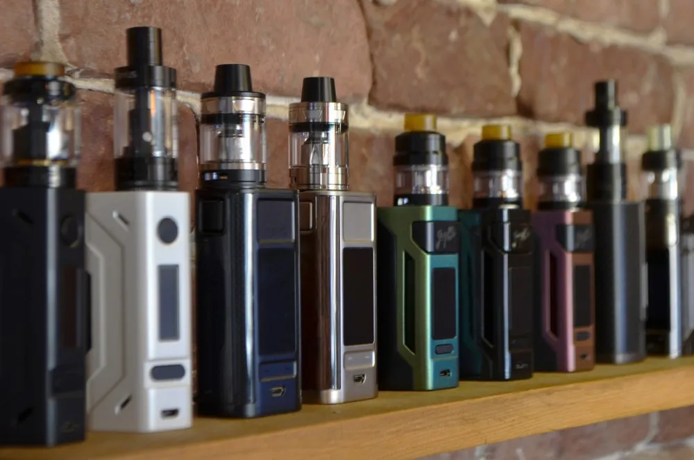 Person shopping for vapes on a laptop with vape products on screen